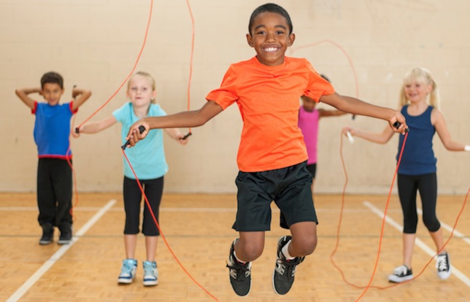 Diverse Elementary Gym Class SpiderFit Kids