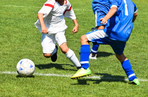 Young soccer players in action